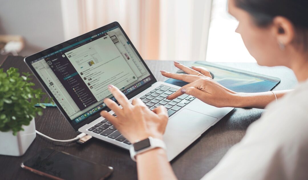 Person packing online orders at home, deciding whether their side hustle is a business.